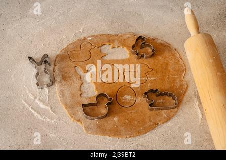 Easter baking flat lay.Spring symbols made from gingerbread.Homemade cookies.Easter bunny,rabbit,eggs and ducks from delicious honey dough. Stock Photo