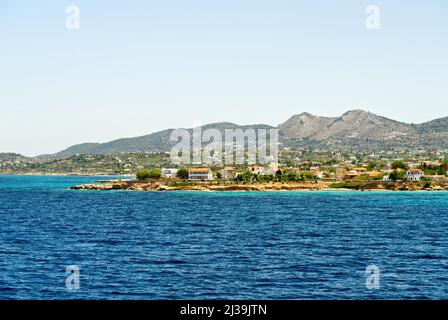 view from the deck of the ferry during sail in Greece. the Greek island Aegina on the background. Stock Photo