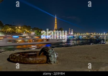 Tourists View of Boat Cruises in Paris at Night With Eiffel Tower Stock Photo