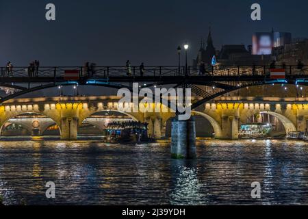 Peoples on Docks in Paris Touristic Center With Seine River and Bridge
