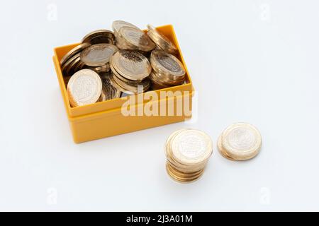 Stacks of Turkish One Lira coins on the white background. Stock Photo