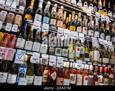 Lynnwood, WA USA - circa April 2022: Angled view of refrigerated wine inside a Town and Country grocery store. Stock Photo