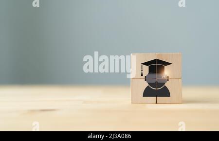 Virtual reality (VR) education concept. Futuristic school science class for children learning in STEM Programs. Wooden cubes with chldren using virtua Stock Photo