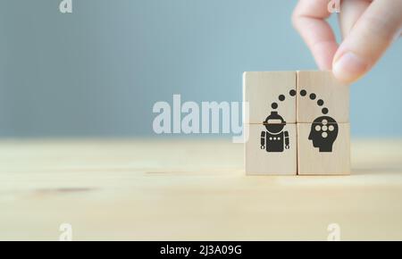 Artificial intelligence and machine learning concept. Illustration on wooden cubes with teaching human brain intelligence to machines through machine Stock Photo