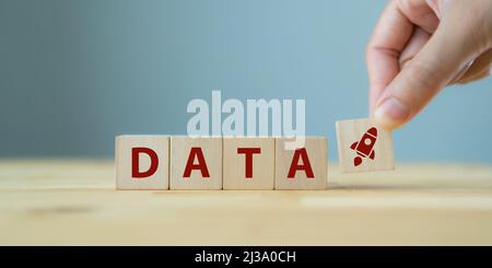 Data driven literacy concept. Business strategy,personalized and contextual marketing. Digital technology for analytic skill. hand holds wooden cube w Stock Photo