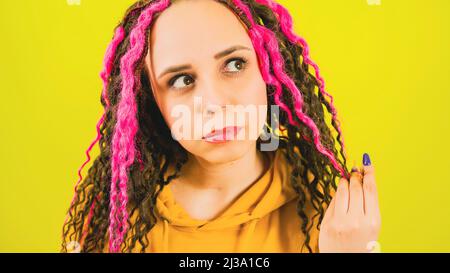 Beautiful female with curly hair looking away and reflecting on life. Stock Photo