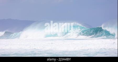 Giant waves crashing at Banzai Pipeline Stock Photo