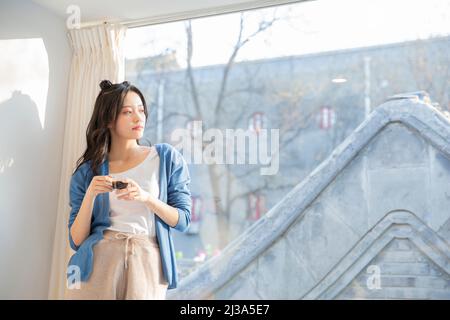 The leisure time of beautiful young fashionable lady in Beijing - stock photo Stock Photo