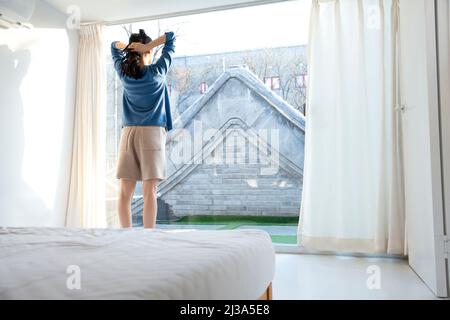 The leisure time of beautiful young fashionable lady in Beijing - stock photo Stock Photo