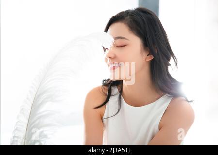 Beautiful young lady with a fine face and fine clothes - stock photo Stock Photo