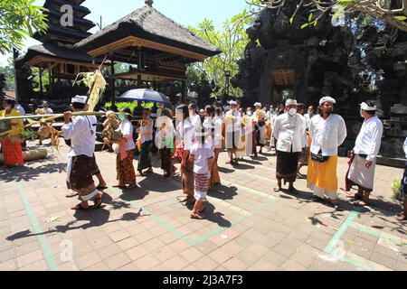 Ceremony at Pura Goa Lawah or Goa Lawah Bat Cave Temple in Goa Lawah, Klungkung, Bali, Indonesia. Stock Photo