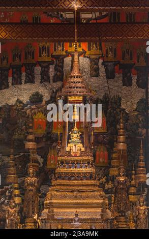 Bangkok, Thailand - Mar 29, 2022: The Emerald Buddha in Phra Ubosot or The Chapel of the temple of the emerald buddha at the grand palace. Stock Photo