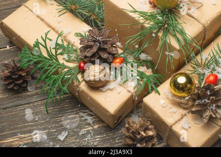 Luxury New Year gifts, different present boxes under Christmas tree in holiday eve, Christmastime celebration, home decorated with festive shiny balls Stock Photo