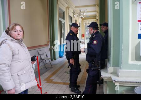 Przemysl, Poland. 3rd Apr, 2022. A Ukrainian Refugee and three firemen in the halls leading to the sleeping area for refugees (Credit Image: © Amy Katz/ZUMA Press Wire) Stock Photo