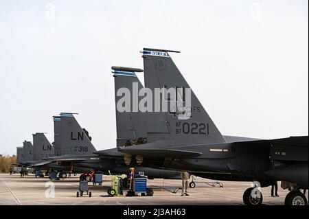 U.S. Air Force F-15E Strike Eagles assigned to the 492nd Fighter Squadron from Royal Air Force Lakenheath, England sit at Andravida Air Base, Greece, April 5, 2022. The 48th Fighter Wing from Royal Air Force Lakenheath flew alongside the Hellenic air force and other NATO partners during INIOCHOS 22, a Hellenic air force led exercise designed to enhance the interoperability and skills of allied and partner forces in the accomplishment of joint operations and air defenses. (U.S. Air Force photo by Staff Sgt. Malissa Lott) Stock Photo