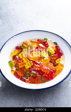 Jelly gummy bears candy. Colorful sweet confectionery in plate. Stock Photo