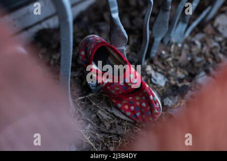 children's shoes in the ruins, the war Stock Photo