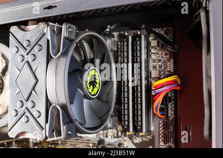 Cooling fan for the central processing unit of a personal computer. Air cooling. Inside the computer system unit. Stock Photo