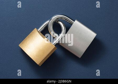 Locked Padlocks on the blue background. Stock Photo