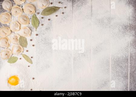 process of cooking pelmeni with chef's hands, top view Stock Photo