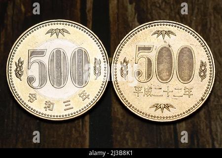 (L to R) Samples of the new and old versions of the Japanese 500 yen coins are photographed on April 7, 2022, in Tokyo, Japan. The latest version coin in two-tone was issued in the first half of fiscal 2021 to commemorate the 150th anniversary of the modern currency system. Credit: Rodrigo Reyes Marin/AFLO/Alamy Live News Stock Photo