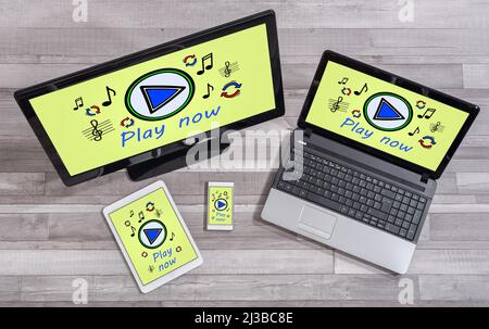 Online music concept shown on different information technology devices Stock Photo