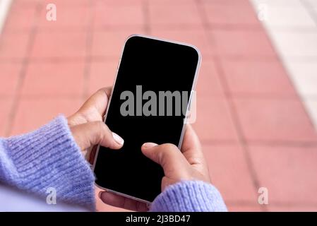 Unrecognizable African American Female Browsing Smartphone With Black Screen, Mockup Image Stock Photo