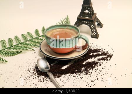 Photo studio concept coffee latte cappuccino in a cup with eiffel tower miniature french background Stock Photo