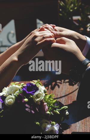 Hands newlyweds lovers express their feelings. Stock Photo