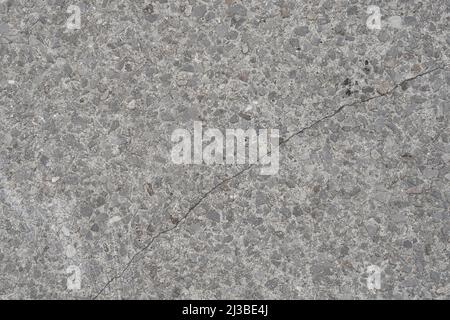 Mosaic quartz cracked gray road tiles close up. Abstract background Stock Photo