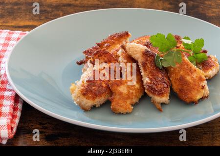 fried chicken with breadcrumbs on a plate Stock Photo