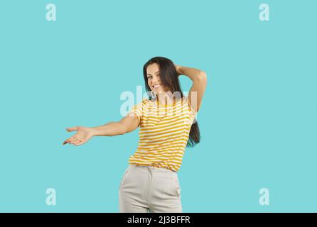 Smiling woman have fun dancing in studio Stock Photo