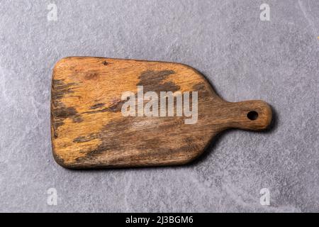 Cutting board on gray background Stock Photo
