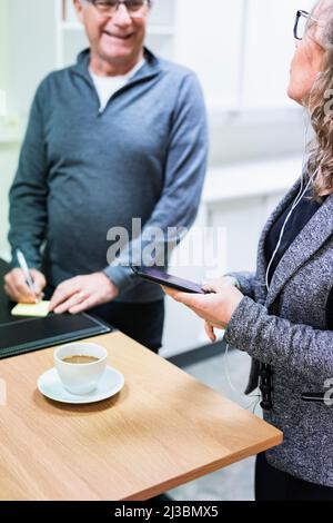 Colleagues working and drinking coffee Stock Photo