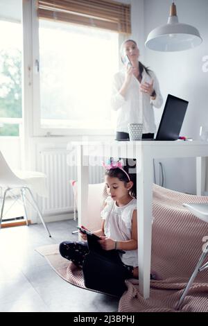 Mother and daughter at home Stock Photo