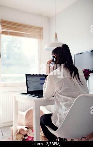 Woman using cell phone Stock Photo