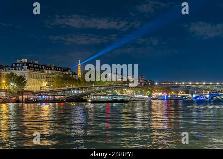A View of Paris at Night Above the Seine River Eiffel Tower Bridges and Boat Cruises Architecture Stock Photo