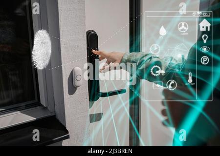 Person using fingerprint door lock Stock Photo