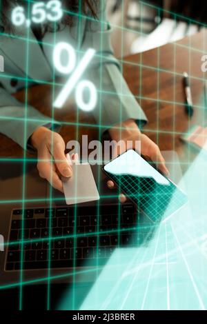 Businesswoman holding smart phone and payment card Stock Photo
