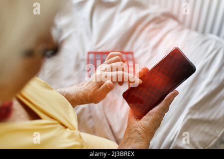 Senior woman using smart phone Stock Photo
