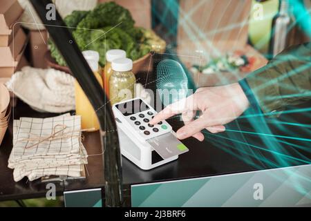 Man paying for food with payment card Stock Photo