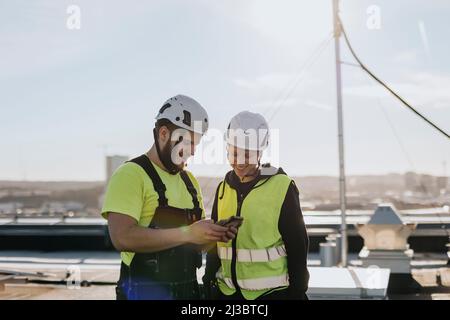 People talking at construction site Stock Photo