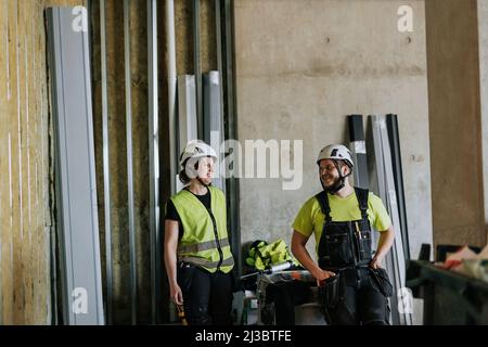 People talking at construction site Stock Photo