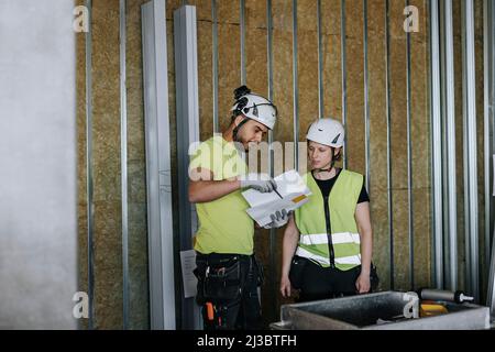 People talking at construction site Stock Photo