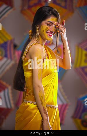 Portrait of a beautiful Indian bride looking at camera with crossed-eyes Stock Photo