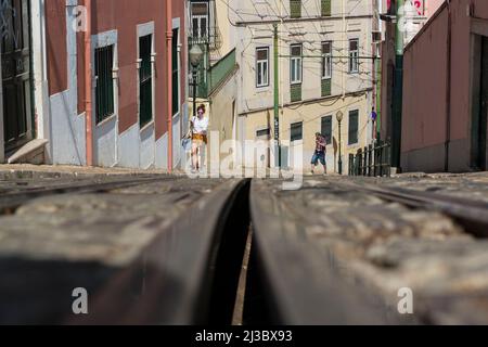 Low angle view of funicular rails in old part of Lisbon, Portugal. Stock Photo