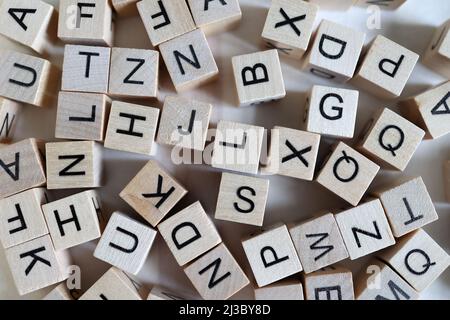 Background of wooden cubes with letters for learning the alphabet. Stock Photo