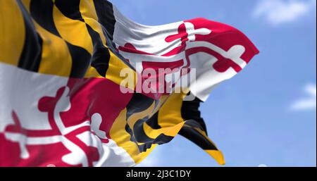 The US state flag of Maryland waving in the wind. Maryland is a state in the Mid-Atlantic region of the United States. Democracy and independence. Stock Photo