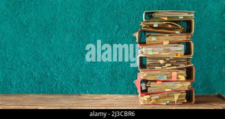 stack of messy file folders,red tape, bureaucracy,aministration,business concept. Large free copy space, negative space technique Stock Photo