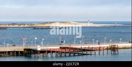 Helgoland, Germany. 26th Mar, 2022. View of the Helgoland dune with the lighthouse on the south beach and the main island's landing stage in the foreground. Credit: Markus Scholz/dpa/Alamy Live News Stock Photo